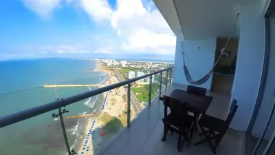 a balcony with a desk and a view of the ocean at Sky Ocean View in Cartagena de Indias
