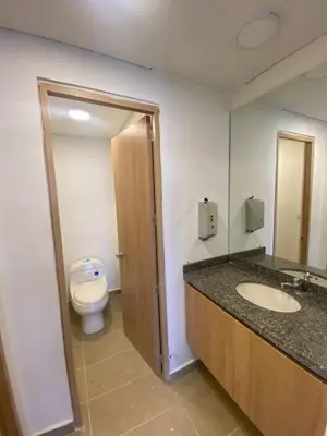 a bathroom with a toilet and a sink at Pool , Private Beach Modern and Serene Apartment in Serena del Mar