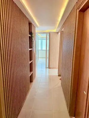 a hallway with wooden walls and a tile floor at Pool , Private Beach Modern and Serene Apartment in Serena del Mar