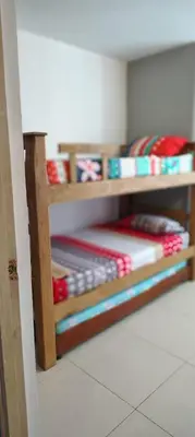 a bunk bed with pillows on the bottom shelf at Cartagenafantastica in Cartagena de Indias