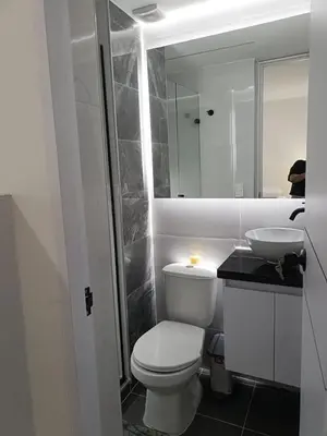 a bathroom with a white toilet and a sink at Apartamento en Cartagena amoblado con vista al mar in Cartagena de Indias