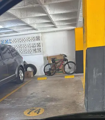 a bike is parked in a parking garage at Exclusividad en el corazón de Barranquilla in Barranquilla