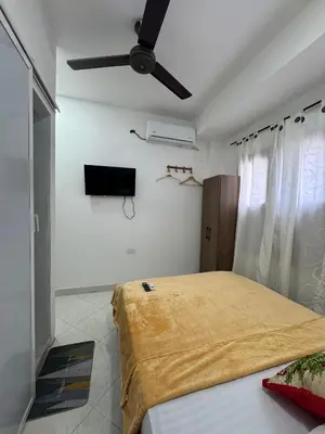 a bedroom with a bed and a ceiling fan at Hotel Casa Colonial Moñitos in Moñitos