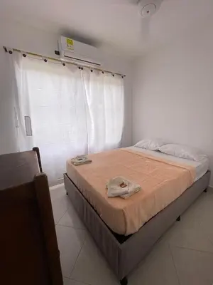 a bedroom with a bed in a room at Hotel Casa Colonial Moñitos in Moñitos