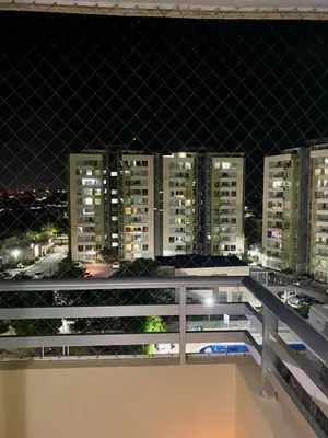 a view of a city at night from a balcony at Apartamento en villa campestre Barranquilla in Barranquilla