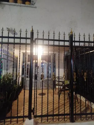 an ornate iron fence in front of a building at Ebratt Inn in Cartagena de Indias