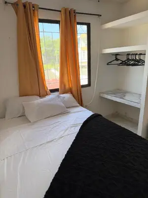 a bedroom with a large bed with a window at Apto emperatriz house in Cartagena de Indias