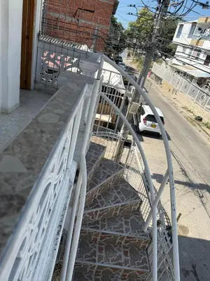 a metal staircase leading up to a building at Apto emperatriz house in Cartagena de Indias