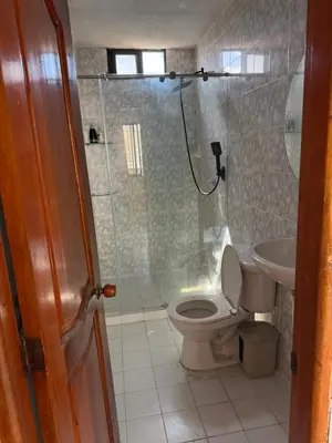 a bathroom with a shower and a toilet and a sink at Emperatriz I in Cartagena de Indias