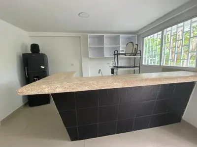 a kitchen with a large counter top in a room at Cómodo & Económico Apartamento en La boquilla BBB 4 pax in Cartagena de Indias