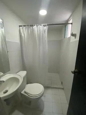 a bathroom with a toilet and a sink and a shower at Cómodo & Económico Apartamento en La boquilla BBB 4 pax in Cartagena de Indias