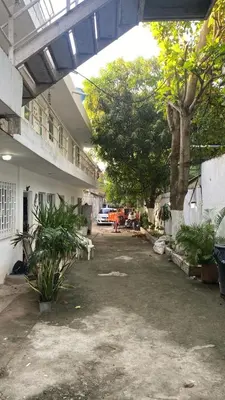 a courtyard of a building with trees and plants at Cómodo & Económico Apartamento en La boquilla BBB 4 pax in Cartagena de Indias