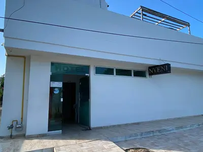 a hotel with a sign on the side of a building at Hotel Nellamar in Puerto Colombia