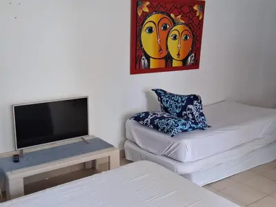 a living room with a flat screen tv and a couch at La perla in Cartagena de Indias