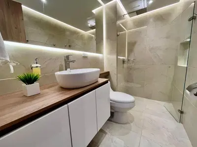 a bathroom with a sink and a toilet at cartagena beach resort in Cartagena de Indias