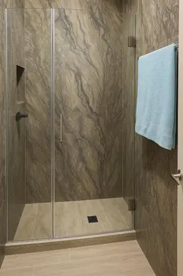 a shower with a glass door and a blue towel at 406 Sea Breeze and Luxury in Cartagena in Cartagena de Indias