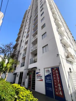 a tall white building with a sign in front of it at 406 Sea Breeze and Luxury in Cartagena in Cartagena de Indias