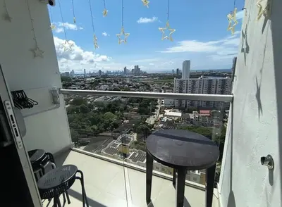 a balcony with a table and a view of a city at Piso 2206 Mirador de Cartagena in Cartagena de Indias