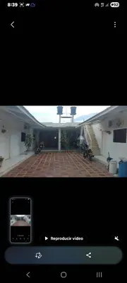 a view of a house with a view of a courtyard at Hospedaje el floral in Tolú