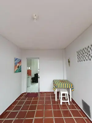 a living room with a couch and a chair at Apartamentos en Sabanilla, Colombia -Tu Escapada Ideal! in Maizal