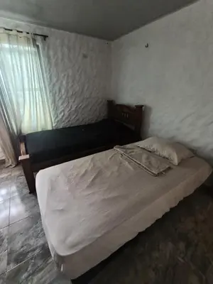 a bedroom with a bed and a window at Apartamentos en Sabanilla, Colombia -Tu Escapada Ideal! in Maizal