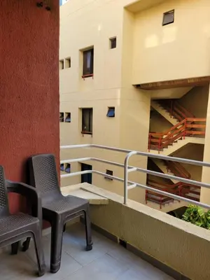 two chairs sitting on the balcony of a building at Apto en EL Cabrero, Edificio Manzanillo del Mar in Cartagena de Indias