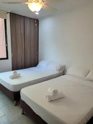 two beds sitting next to each other in a room at Apto en EL Cabrero, Edificio Manzanillo del Mar in Cartagena de Indias