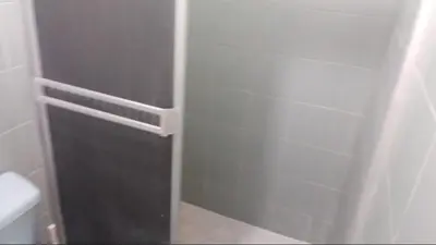 a bathroom with a shower stall and a toilet at Hospedaje el Floral in Tolú