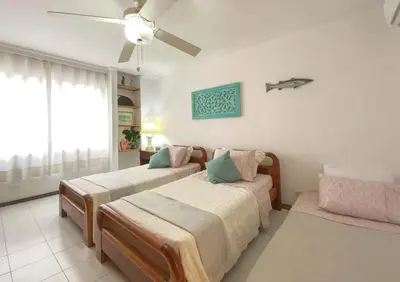 a bedroom with two beds and a ceiling fan at Great Apartment With Private Pool in Cartagena de Indias