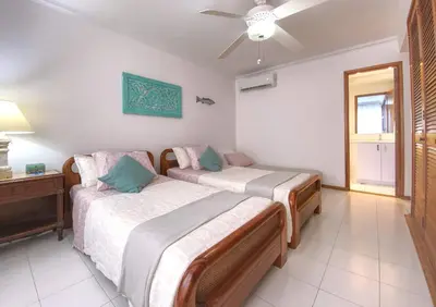 a bedroom with two beds and a ceiling fan at Great Apartment With Private Pool in Cartagena de Indias