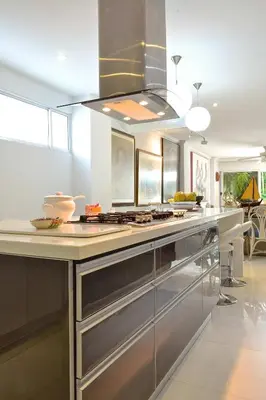a kitchen with stainless steel appliances and a stove at Great Apartment With Private Pool in Cartagena de Indias