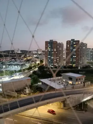 a view of a city with buildings and a highway at Apartamento de 3 habitaciones, al norte de Barranquilla, via a Cartagena, aire acondicionado en sala y todas las habitaciones, excelenten para trabajo o descanso in Barranquilla