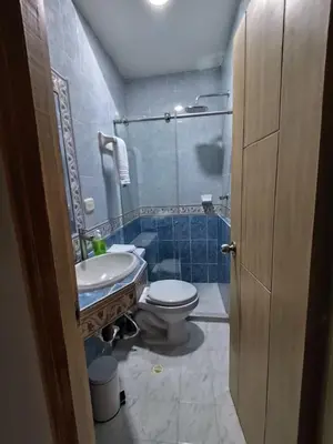 a bathroom with a toilet and a sink and a shower at Apartamento en Cielo Mar in Cartagena de Indias