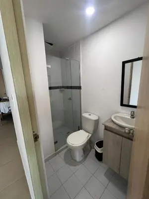a bathroom with a toilet and a shower and a sink at Apto Familiar Moderno Cerca de Todo en Coveñas in Coveñas