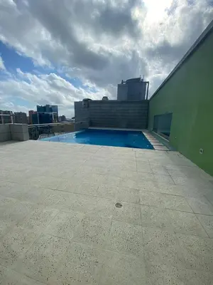 a swimming pool on the roof of a building at Blue Gardens in Barranquilla