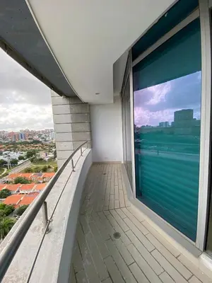 a balcony with a large window with a view at Blue Gardens in Barranquilla