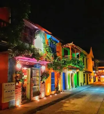 a group of buildings with colorful lights on a street at Julius cartagena in Cartagena de Indias