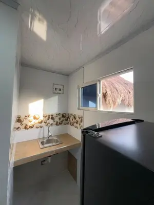 a small kitchen with a sink and a window at Orilla beach house in Playa Punta Arena