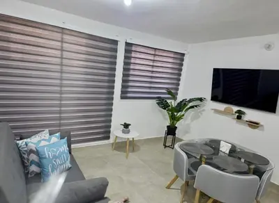 a living room with a couch and a glass table at Apartamento Cartagena Tranquilo playa-piscina in Manzanillo del Mar