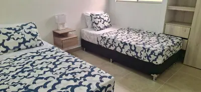 a bedroom with two beds in a room at Apartamento Cartagena Tranquilo playa-piscina in Manzanillo del Mar