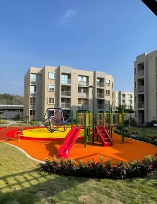 a playground in front of a apartment building at Apartamento Cartagena Tranquilo playa-piscina in Manzanillo del Mar