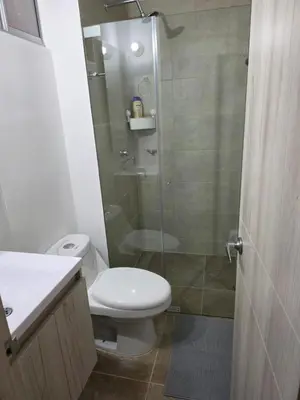 a bathroom with a toilet and a glass shower at Apartamento Cartagena Tranquilo playa-piscina in Manzanillo del Mar