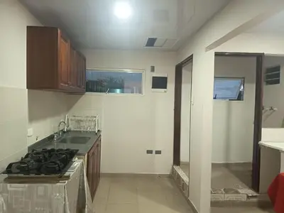 a kitchen with a sink and a stove top oven at Hotel Cartagena antigua in Cartagena de Indias