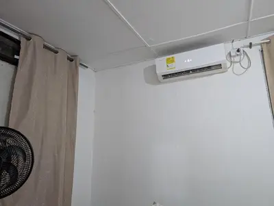 a air conditioner on the ceiling of a room at Central Point Air BAQ in Barranquilla