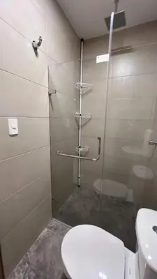 a bathroom with a shower with a toilet and a sink at Sofia del Mar in Puerto Colombia