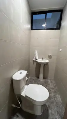 a bathroom with a toilet and a sink at Sofia del Mar in Puerto Colombia