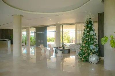 a living room with a christmas tree in a lobby at Morros Serena del Mar in Cartagena de Indias