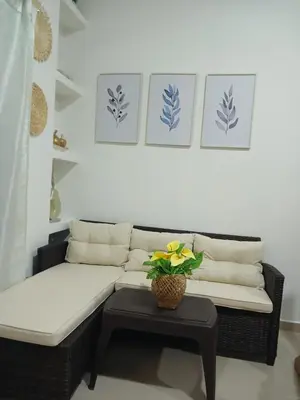 a living room with a couch and a table at Mararena in Coveñas