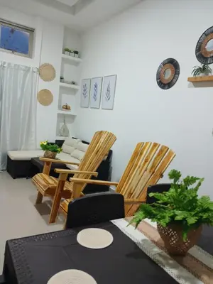 a living room with two chairs and a table at Mararena in Coveñas