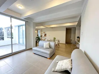 a living room with a couch and a table at Villa in Sabanilla near the Sea in Maizal